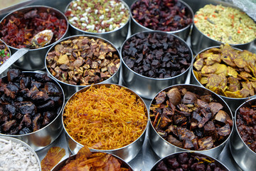 Different spices and herbs in metal bowls on a street market in Kolkata, West Bengal, India