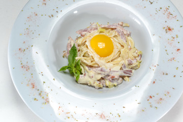 fried egg with bacon on plate