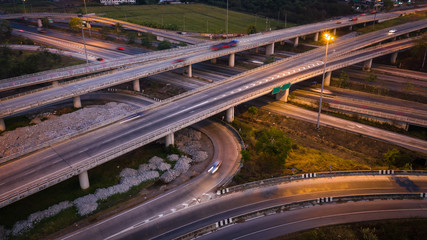 Fototapeta na wymiar twilight landscape long exposure movement traffic car on expressway interchange in Thailand