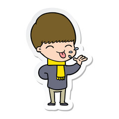 sticker of a cartoon boy sticking out tongue
