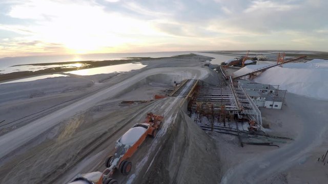 Aerial shot of a large truck before unloading the salt salt in the salt flats by solar evaporation in Guerrero Negro, Ojo de Liebre lagoon, Biosphere Reserve of El Vizcaino, Baja California Sur.
