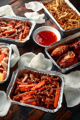 Chinese takeaway food. Crispy shredded beef, sweet and sour chicken wings, egg noodles with bean...