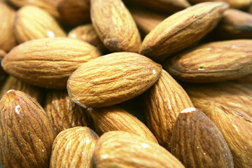 Fototapeta premium Almonds peeled macrophotography as background for design.