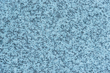 Fototapeta na wymiar Granite wall with azure or bluish tint as background