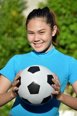 Portrait Of A Fitness Minority Female Soccer Player With Soccer Ball