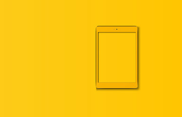 Tablet computer isolated on yellow.