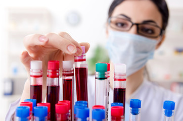 Fototapeta premium Young female chemist working in the lab 