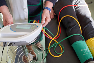 Peripheral artery disease measuring for patient ankle brachial index (ABI) test.