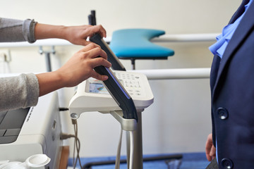 Close up of woman smart Body Composition Analysis by doctor before Fitness Activity. Woman Checking body with Body Composition Analysis machine. weight loss