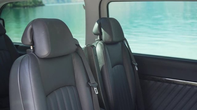 SLOWMO - Leather seats interior of luxury minivan by Lake Wakatipu, Queenstown, New Zealand