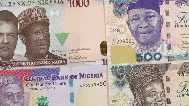 Nigeria currency naira notes slow rotating. Nigerian money, trade, economy, market. 4K stock video footage