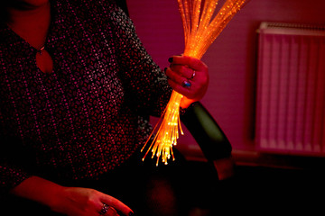 woman in color therapy in the retirement care home. multi sensory stimulating room