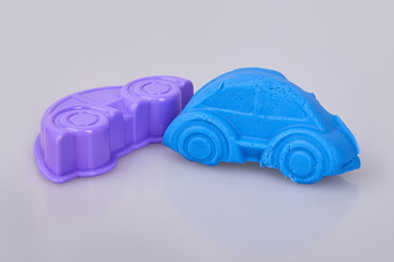 A car formed  from blue play dough (plasticine). Modeling. Play dough in preschool or nursery for...