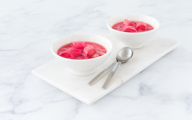 Two Bowls on Marble Board filled with Rhubarb Compote