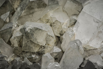 Abstract background or texture from a stone in a section, a white and gray shade. Natural and solid material. Crystals.