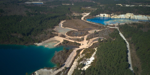 Old clay quarry turned into a lake, drone point fo view