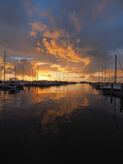 Colorful sunrise after a rainstorm over Dinner Key Marina in Coconut Grove, Miami, Florida.