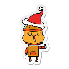 happy sticker cartoon of a robot wearing santa hat