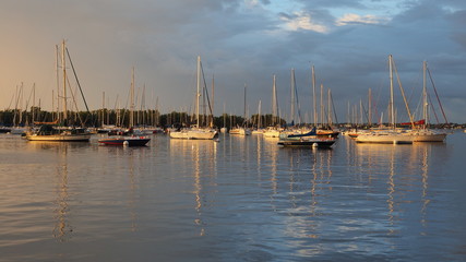 Fototapeta na wymiar Early light after a rainstorm on the anchorage at Dinner Key Marina in Coconut Grove, Miami, Florida.