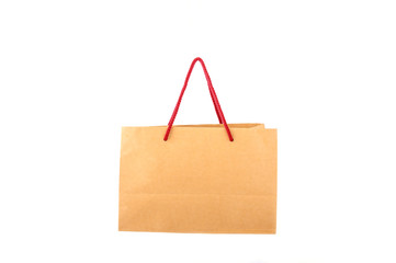 Brown paper shopping bag with red handle robe isolated on white background - Powered by Adobe