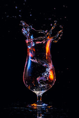 Water splash in a cocktail glass