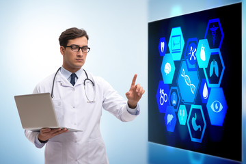 Doctor in telemedicine concept looking at screen