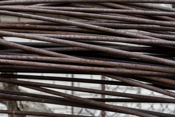 Close up of a large cluster of steel rods intended for use at a construction site. 