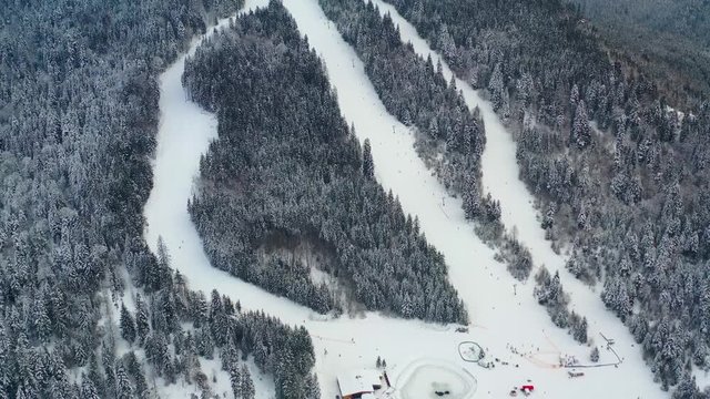 Aerial view of Borsec ski slope with frozen forest in Romania