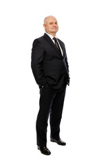 Bald middle-aged man in a suit, full-length, isolated on white background. Vertical.