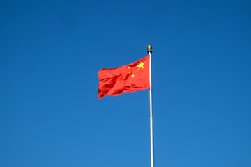 Flag of China on the mast in Tiananmen Square in Beijing, China