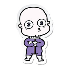 sticker of a cartoon weird bald spaceman