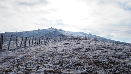 fence to the summit in a dreamy winter landscape