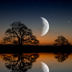 water reflection with moon during sunrise