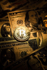Fototapeta na wymiar Bitcoin golden coin cryptocurrency on golden US dollar.