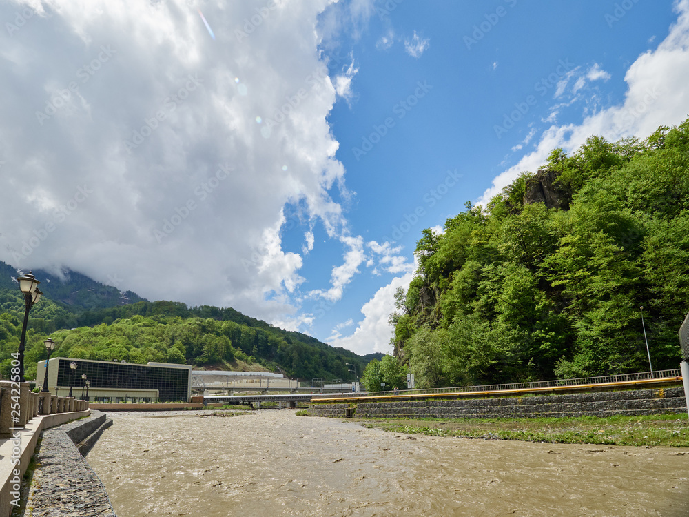 Wall mural the powerful flow of a mountain river in the spring. spring flood