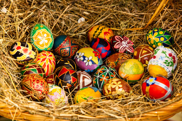 Easter composition with Easter eggs in nest. Easter decor. Easter eggs in straw. Top view