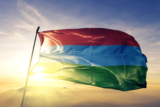 Karelia Republic of Russia flag waving on the top sunrise mist fog
