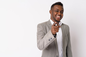 Portrait of happy young African businessman pointing at camera