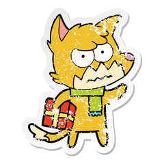 Obraz na płótnie Canvas distressed sticker of a cartoon annoyed fox carrying gift