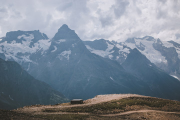 Panorama of mountains scene with dramatic blue sky in national park of Dombay