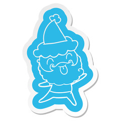 Sticker of a man with beard sticking out tongue wearing santa hat