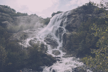 Panorama view of waterfall scene in mountains, national park of Dombay, Caucasus