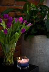 Tulips and candle home decoration