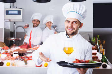 Chef standing in fish restaurant