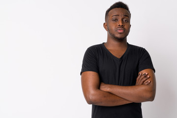 Portrait of young African man with arms crossed