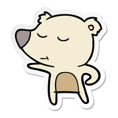 sticker of a happy cartoon bear pointing