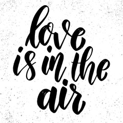 Love is in the air. Lettering phrase on grunge background. Design element for poster, card, banner.