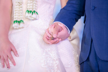 Man and woman holding hands in wedding ceremony . bride and groom holding hand in wedding ceremony.