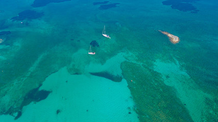 Fototapeta premium Colonia Sant Jordi, Mallorca Spain. Amazing drone aerial landscape of the charming Estanys beach and the boats with a turquoise caribbean sea