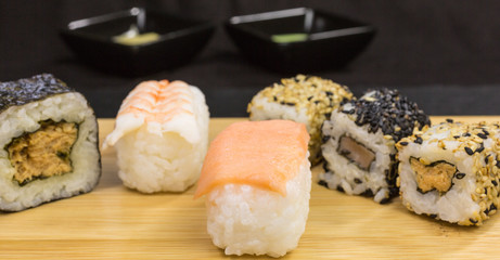 variations of sushi rolls with nigiri and california rolls